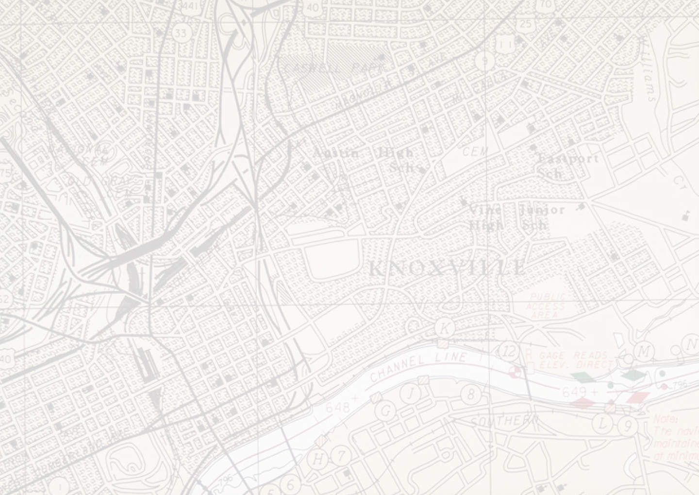 A detailed city map displays roads, buildings, and a river with navigation details, rendered in faded, light gray and white tones with subtle red and green markings.