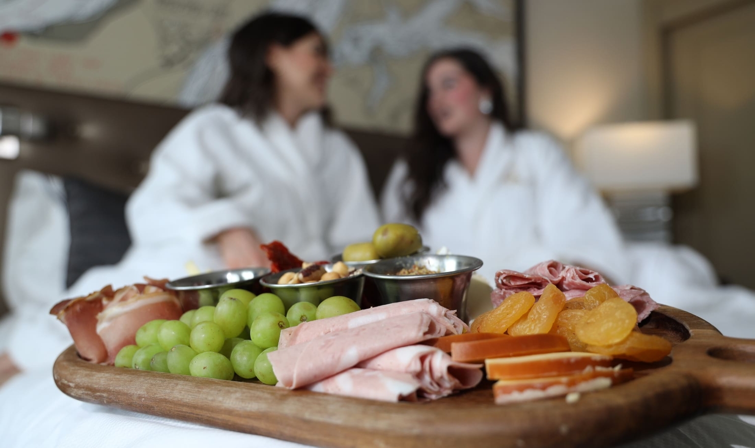 charcuterie board on bed
