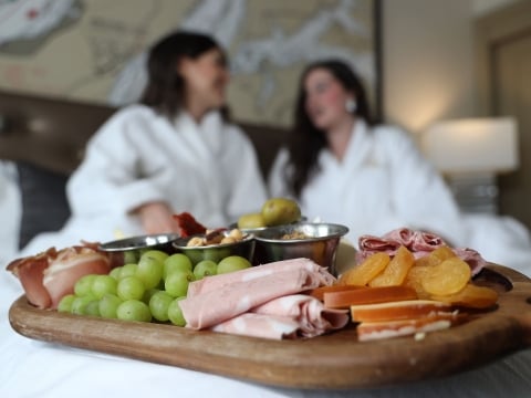 charcuterie board on bed